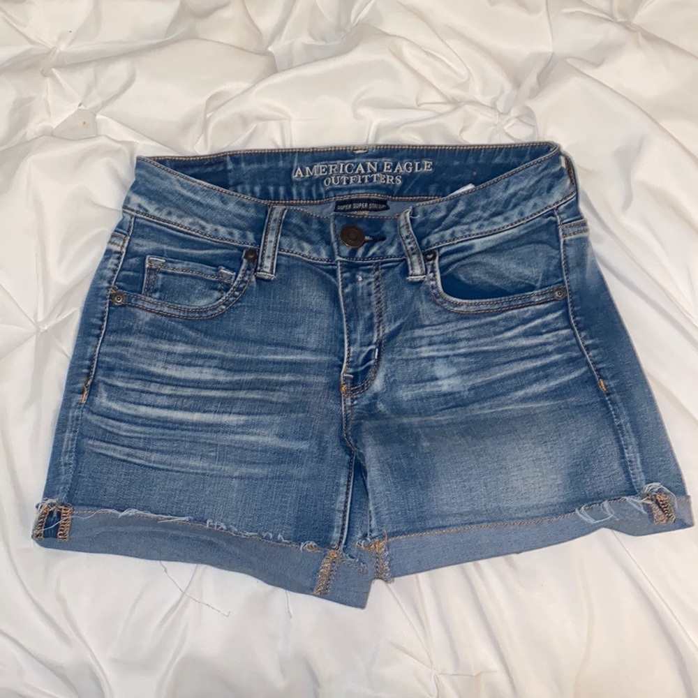 American Eagle Outfitters super super stretch midi med wash jean shorts size 4